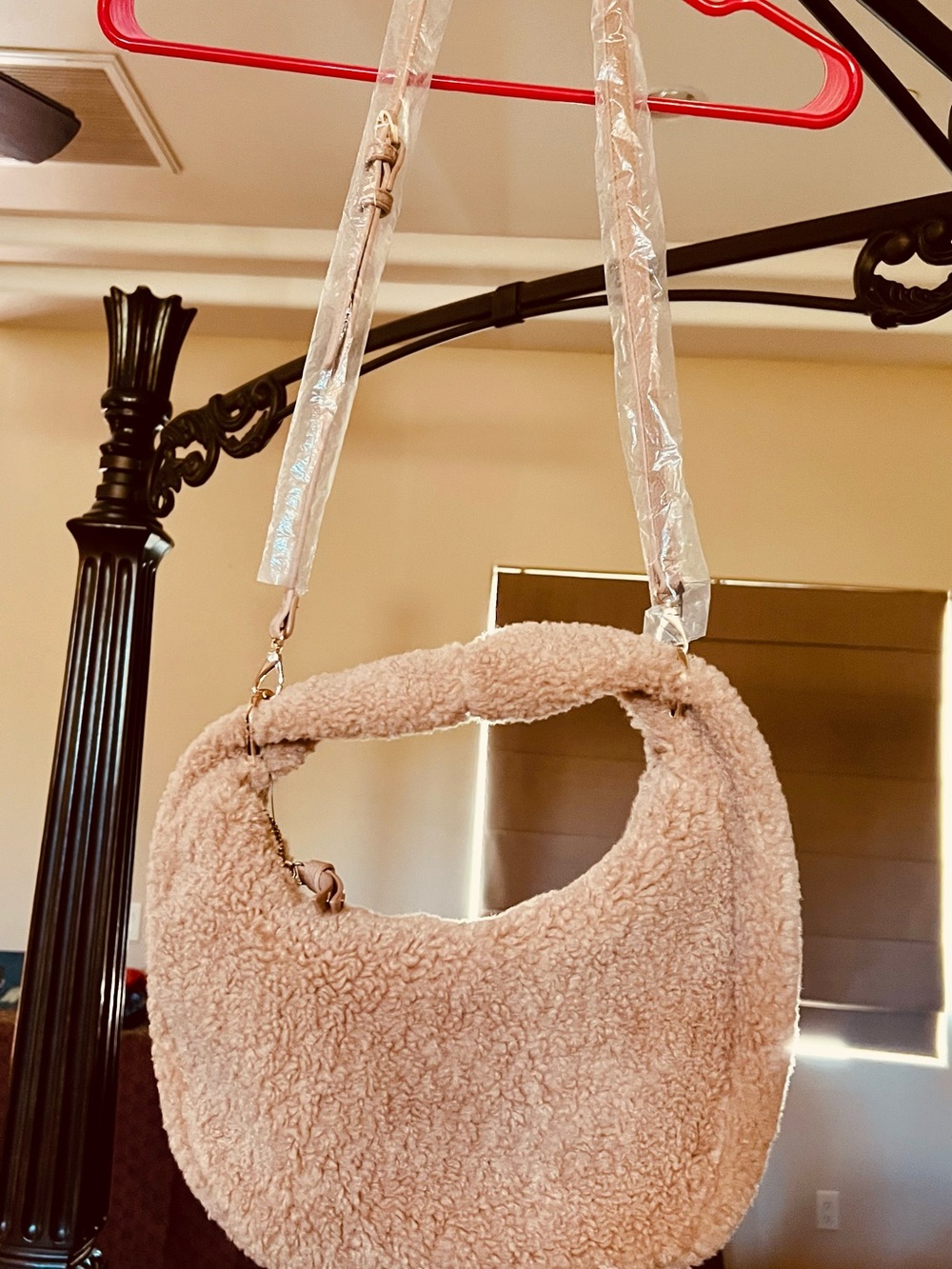 Cozy Crescent Shoulder Bag in Light Beige.
Color is listed as Warm Sesame
